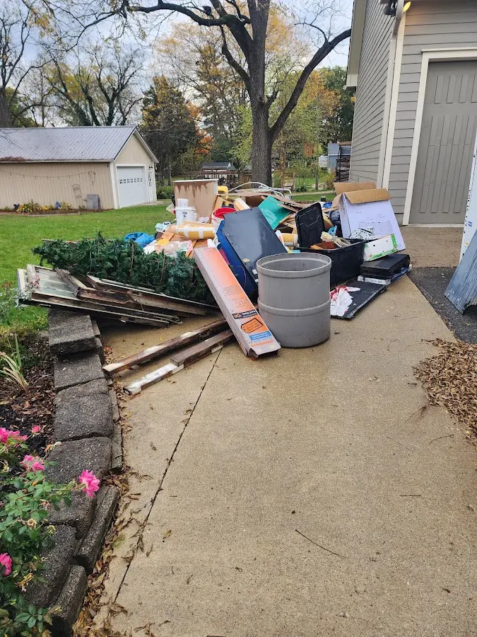 Dumpster being loaded with debris for Roofing Dumpster Rental in Bensalem